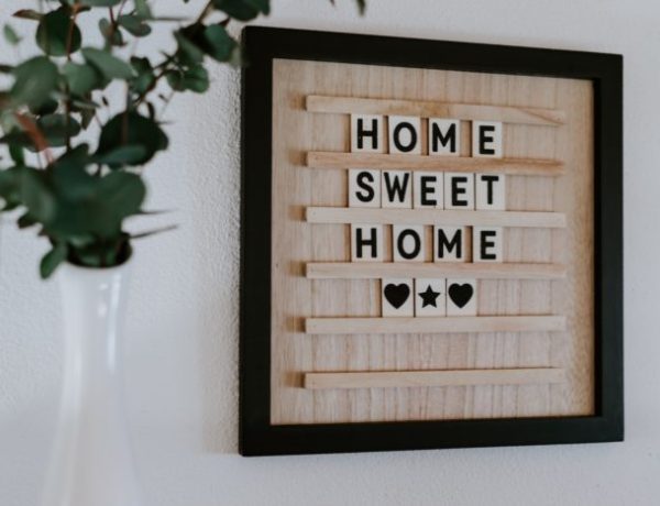 Home sweet home sign on white wall